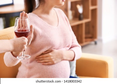 Pregnant Woman Rejecting Alcohol At Home