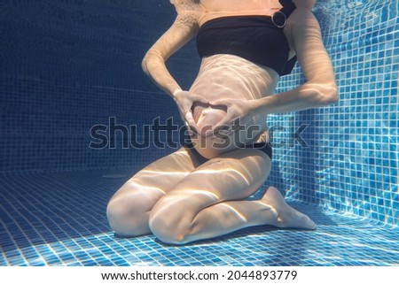 Similar – Image, Stock Photo Unrecognizable pregnant woman diving in sea