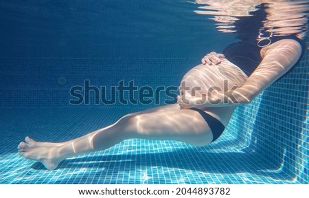 Similar – Image, Stock Photo Unrecognizable pregnant woman diving in sea