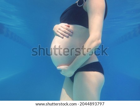 Similar – Image, Stock Photo Unrecognizable pregnant woman diving in sea