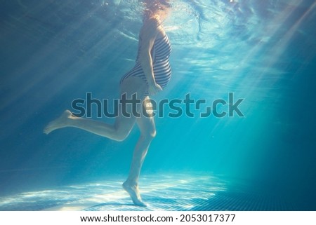 Similar – Image, Stock Photo Unrecognizable pregnant woman diving in sea
