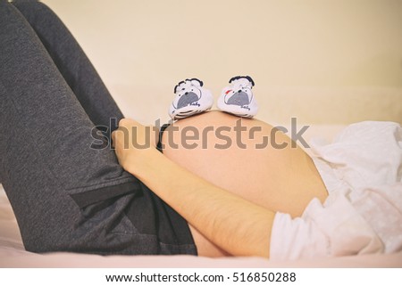 Similar – Pregnant woman embraced by her husband