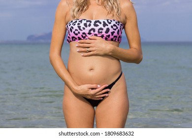 Pregnant woman at sea water
