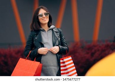 Pregnant Woman With Shopping Bags Buying Baby Stuff. Mother To Be Organizing Baby Arrival And Purchasing Newborn Item
