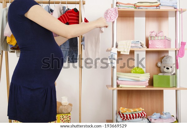 Pregnant Woman Shopping Clothes Her Newborn Stock Photo Edit Now