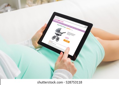 Pregnant woman shopping online on baby store