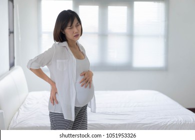 Pregnant Woman Show Sign Of Discomfort, Backache, Stomachache, Labour Pain