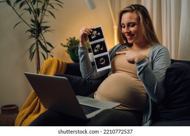 Pregnant Woman Showing Her Baby Ultrasound Photo On A Video Call