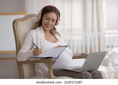 Pregnant woman sit with laptop listen gp therapist advises makes notes, receive online consultation during pregnancy, use internet write helpful information. New knowledge, tech, prenatal care concept - Powered by Shutterstock