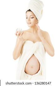 Pregnant Woman Spa, Health Skin Care And Beauty Of Pregnancy. Wrapped In Bath Towels, Applying Cream