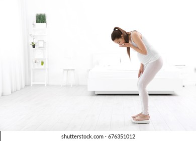 Pregnant Woman Standing On Scales At Home. Pregnancy Weight Gain Concept