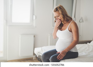 Pregnant Woman Suffering With Nausea In Morning