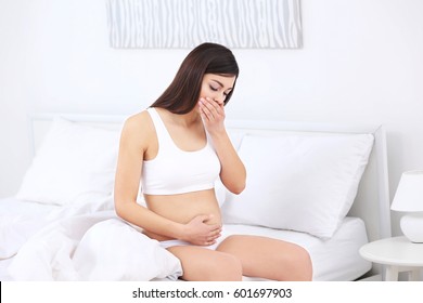 Pregnant Woman Suffering From Nausea In Morning