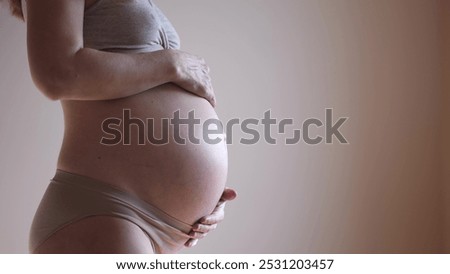 Similar – Baby sleeping on a blanket while her mother looks