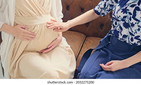 pregnant woman talking in the room. Maternity concept.