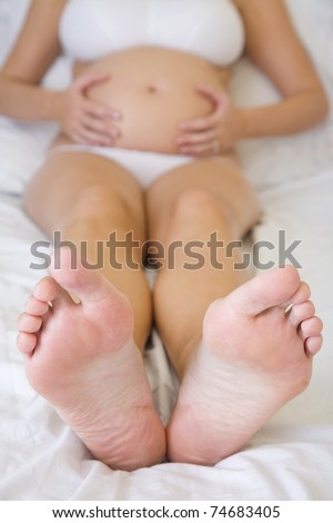 Pregnant woman from the toes up