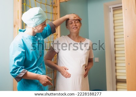 Similar – Caregiver helping elderly patient to stand up