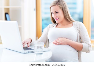 Pregnant Woman Using Laptop 