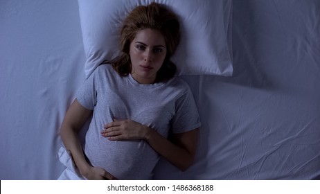 Pregnant Woman Waking At Night In Bed, Pregnancy Difficulties, Insomnia Problem