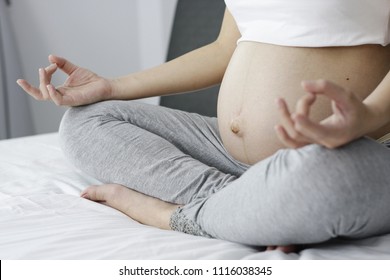 Pregnant Women Are Doing Yoga Poses On The Bed. In The Morning With Copy Space - Stock Photos.
Women, Single Women, Abdomen, Jaw, Exercise