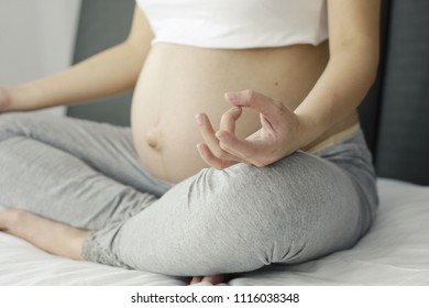 Pregnant Women Are Doing Yoga Poses On The Bed. In The Morning With Copy Space - Stock Photos.
Women, Single Women, Abdomen, Jaw, Exercise