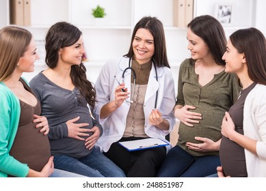 Pregnant Women Are Listening To Doctor At Antenatal Class At The Hospital.