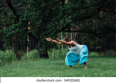 pregnant yoga prenatal maternity doing different exercises. in the park on the grass, breathing, stretching, statics. outdoor, forest. concept of healthy lifestyle and relaxation. meditation.