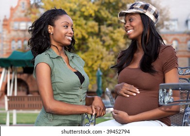 Pregnant young woman chatting