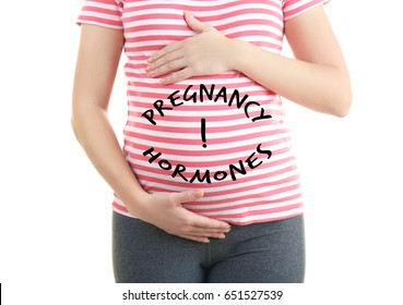 Pregnant Young Woman With Text PREGNANCY HORMONES On Belly, White Background