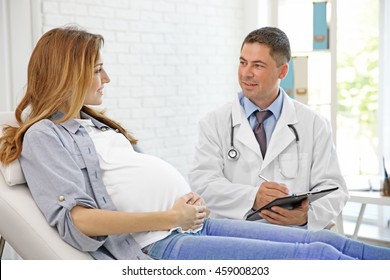 Pregnant Young Woman Visiting Doctor