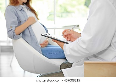 Pregnant Young Woman Visiting Doctor