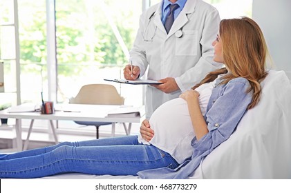 Pregnant Young Woman Visiting Doctor