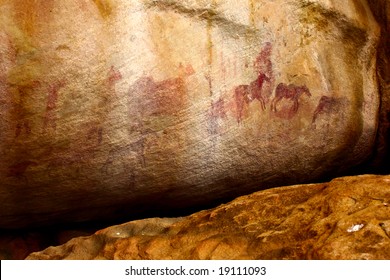 Prehistoric Aboriginal Social Life Scenes. African Bushmen (San People) Tribal Wall Painting In Mountain Cave Of South Africa (western Cape)