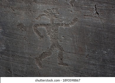 Prehistoric Art In The Unesco World Heritage Site Of Valcamonica, Lombardy, Italy: Rock Drawing Of A Neolithic Man.