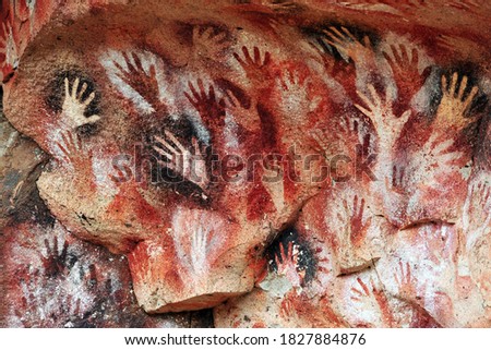 Prehistoric Paintings of hands, at the Cave of the Hands, in Patagonia 