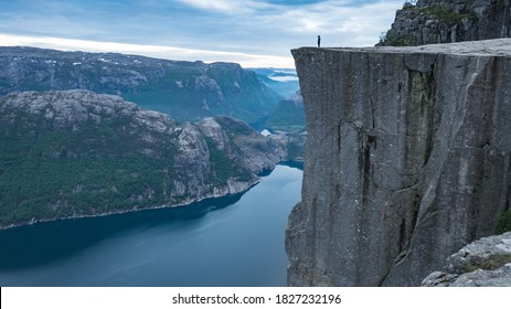 Preikestolen, Norway - May 2016: Man at the top of Pulpit Rock - Shutterstock ID 1827232196