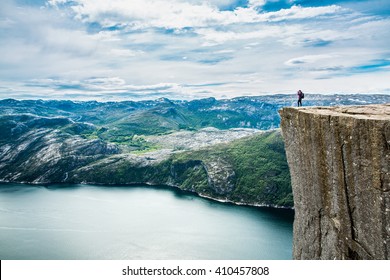 Preikestolen or Prekestolen, also known by the English translations of Preacher's Pulpit or Pulpit Rock, is a famous tourist attraction in Forsand, Ryfylke, Norway - Shutterstock ID 410457808