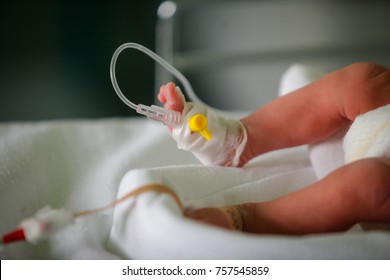 Premature little baby in an incubator at the neonatal section of the maternity
