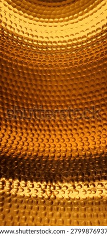 Premium abstract metallic background featuring hammered copper and bronze texture with circular embossed pattern and warm golden illumination. Luxurious industrial surface with elegant reflective details, dimensional structure, and rich metallic tones. Sophisticated decorative texture suitable for premium branding, packaging, luxury advertising, modern interiors, wallpaper, product presentation, and upscale creative design projects. High-detail abstract metal surface with strong visual depth and polished artisan craftsmanship