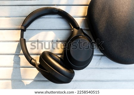 premium headphones kept on a white wooden table in natural light