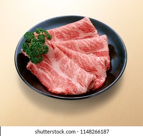 Premium Japanese Wagyu Beef Chuck Eye Roll Sliced On Plate For Sukiyaki