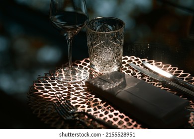 Premium Luxury Dining Setup At A Fancy Restaurant With Crystal Water And Wine Glasses Photographed On A Glass Table. Restaurants Food And Drinks Industry.