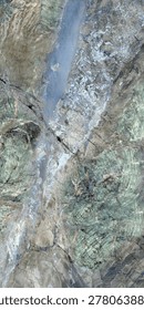 Premium marble texture featuring elegant blue, grey, and soft green mineral tones with intricate natural veining and abstract stone formations. The polished surface creates a luxurious and artistic appearance, ideal for interior design, ceramic tiles, wall cladding, countertops, flooring, architectural projects, and high-end decorative backgrounds.