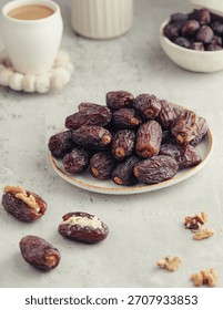 Premium Medjool dates in a rustic table setting with a cup of coffee and soft background. Warm tones and layered composition ideal for cultural food branding, Ramadan visuals, and recipe blogs.