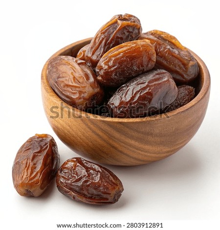 Premium Medjool dates served in a rustic wooden bowl, isolated on a white background. Healthy organic dried fruit, perfect for themes related to nutrition, Ramadan, Eid, vegan diets, natural food, and wholesome snacking.