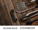 Premium perfect tools for for cooking on an open fire on wooden background. BBQ concept.
