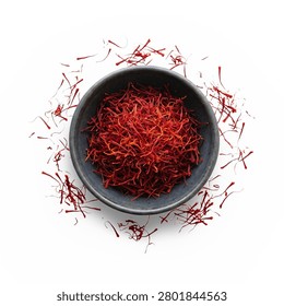 Premium saffron crocus threads in a clay bowl, luxury culinary spice overhead shot.
