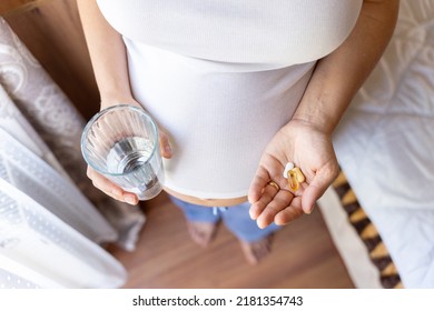 Prenatal Vitamins Pill. Happy Smiling Woman Taking Pill With Supplement Vitamin Omega 3. Vitamin D, E, A Fish Oil Capsules