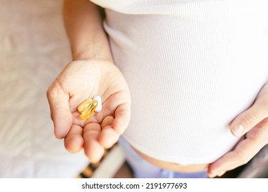 Prenatal Vitamins Pill. Happy Smiling Woman Taking Pill With Supplement Vitamin Omega 3. Vitamin D, E, A Fish Oil Capsules