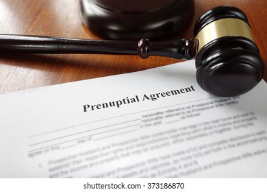 Prenuptial marriage agreement with legal gavel                               